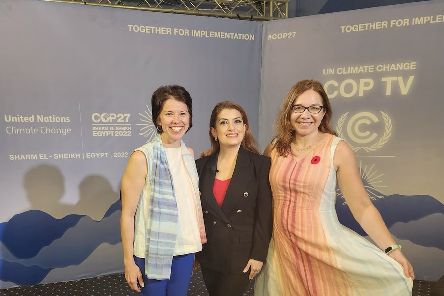 Bernadette Woods Placky with two colleagues at the UN Climate Change COP TV set at COP27 in Sharm el-Sheikh